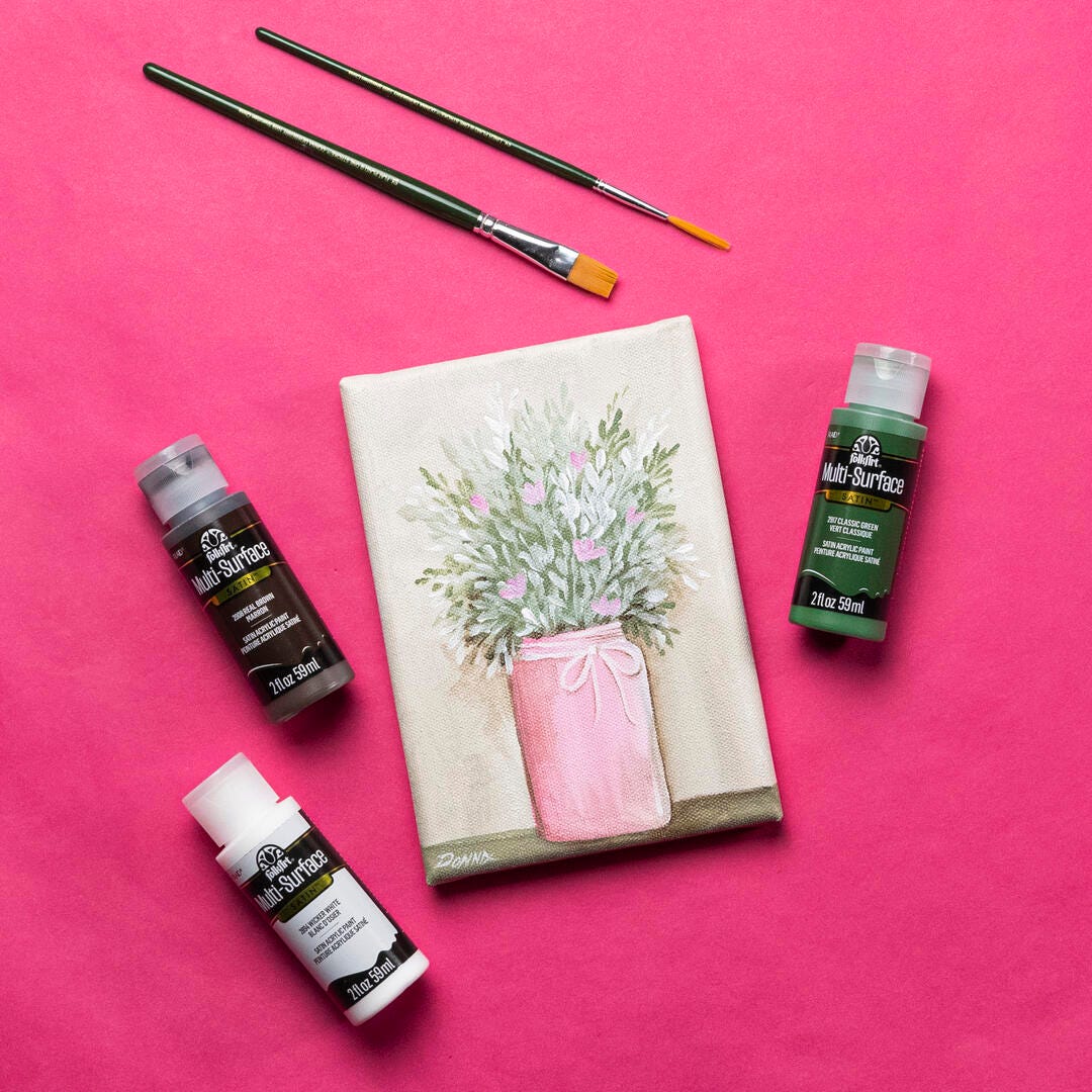 Jar of Greenery and Pink Flowers