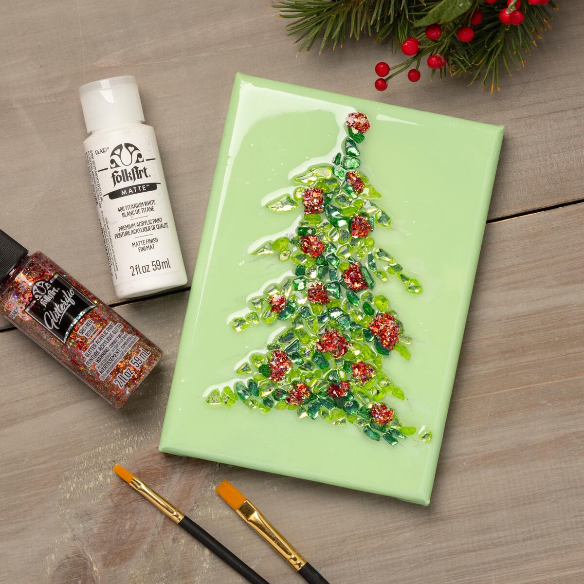 Christmas tree motif on canvas using FolkArt Glitterfic paints, Fragment Effects, and sealed in resin