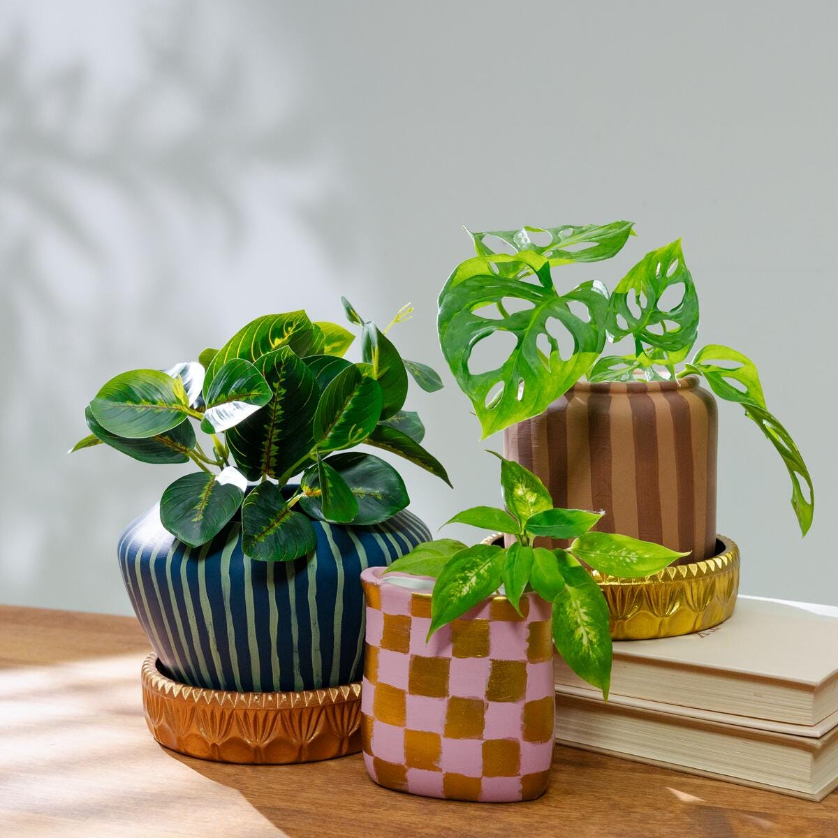 Planters painted with striped and checkered patterns and colors from FolkArt