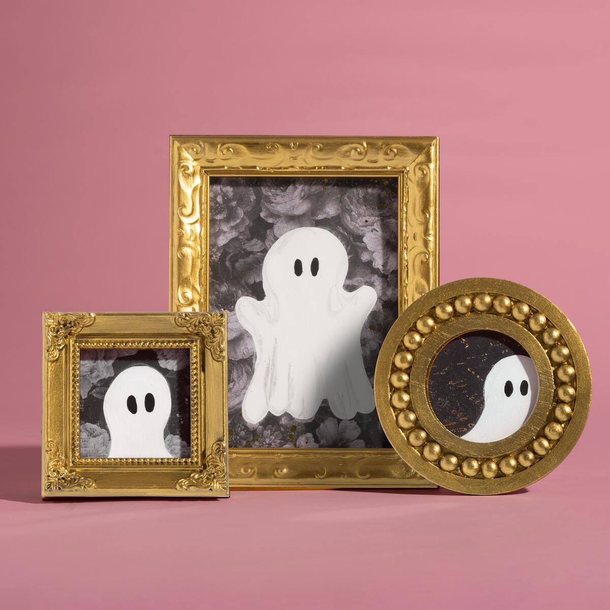 Painted ghost portraits in gold frames