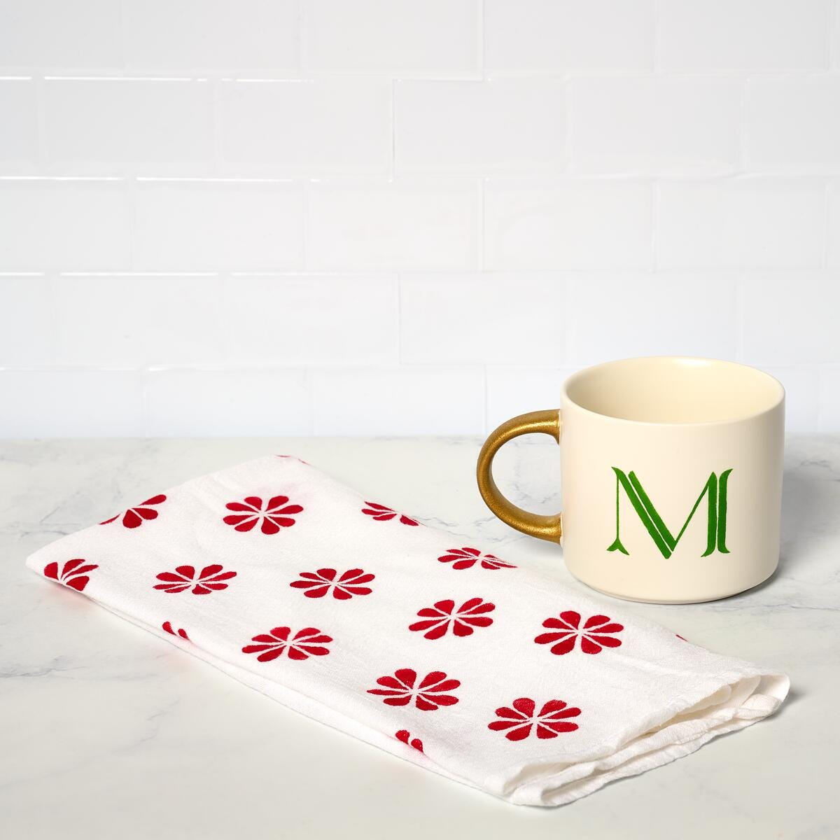 A tea towel and mug painted with Martha Stewart Holiday Classics Paint