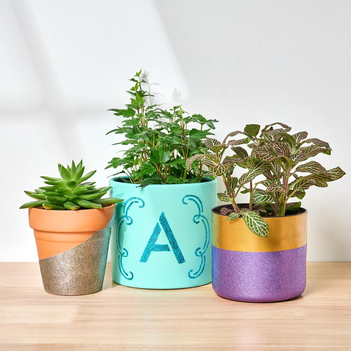 Planters monogrammed with the letter A and painted with Martha Stewart's Studio Lights Paint set